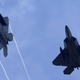U.S. Air Force F-22 Raptors, built by Lockheed Martin Corp., fly above Andersen Air Force Base, Guam. Photo credit AP